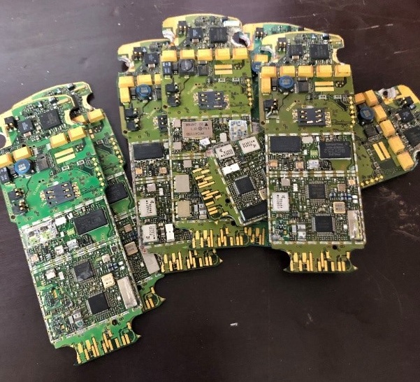 Output of machine 2: printed circuit boards extracted from a mobile phone.